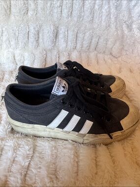 adidas Black Low-Top Sneakers with White Stripes